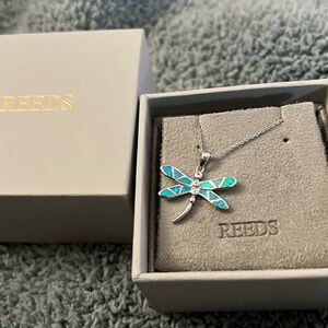 Sterling silver dragonfly necklace from Reeds Jewelers. 18”-20” chain.